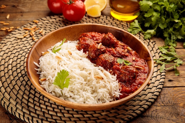 DAWOOD BASHA or meatballs with rice served in a dish isolated on wooden background side view of arabic food