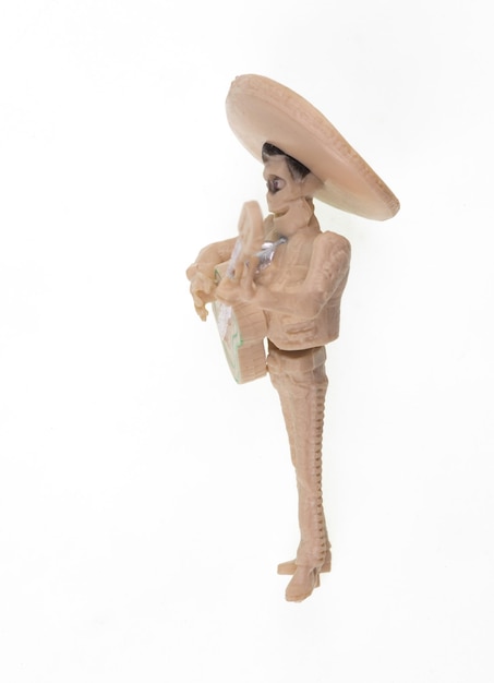 Day of the Dead, Mexican man toy with guitar isolated on white background