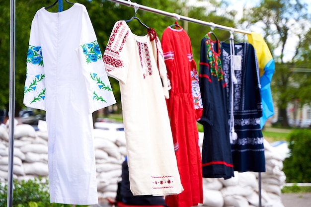 Day of Ukrainian Vyshyvanka Ethnic Ukrainian clothes on a hanger at open air fest