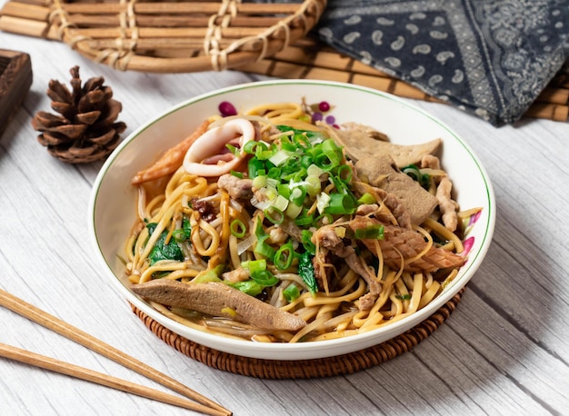 Dayang Chun Noodles Dry in a dish isolated on wood table side view taiwan food