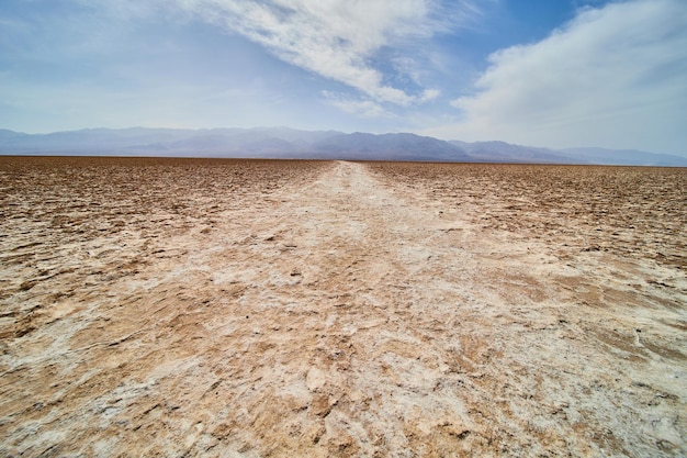 Death valley path through salt flats in badwater basin