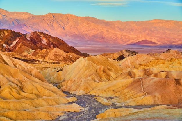 Death Valley stunning sunrise colors in sediment layers of mountains