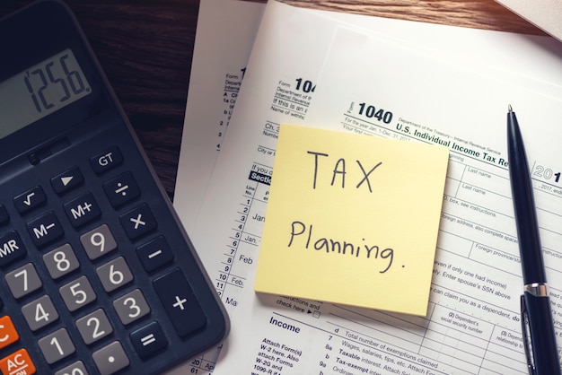 Debt collection and tax planning with deadline calendar reminder note with tax form 1040 payment concepts.