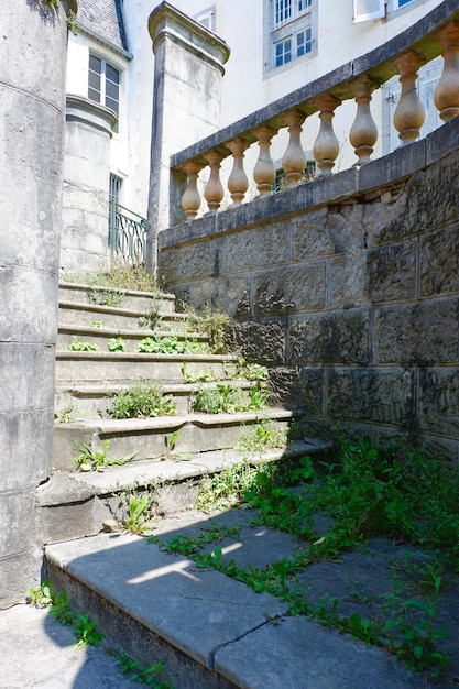 Decayed vintage stairs from outside in Pau France Abandoned French architecture Vertical photo