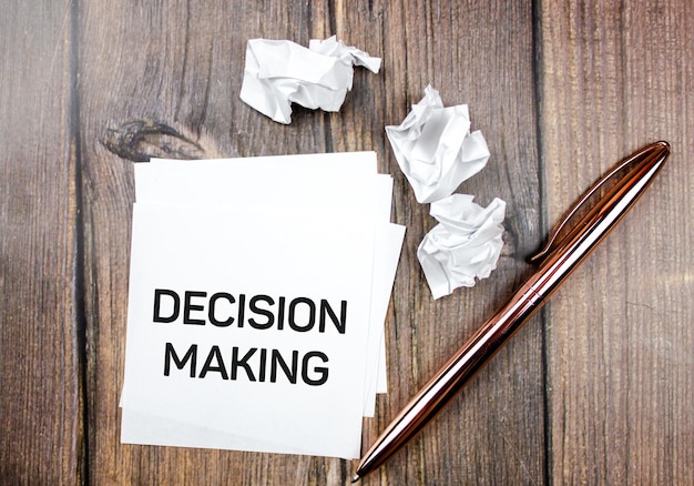 Decision making text on paper next to holy shreds Business concept