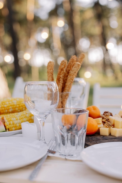 Decor in boho style Picnic in the nature table Holidays in the nature concept