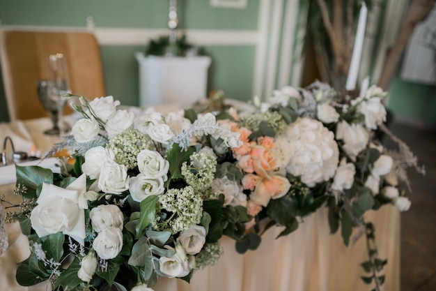 Decor of flowers at a wedding in a banquet hall