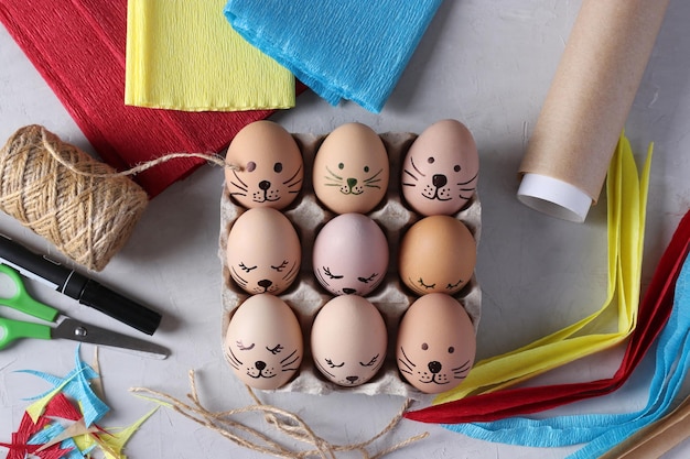 Decorate eggs for Easter using colored paper and parchment in the form of rabbits Using a marker dra