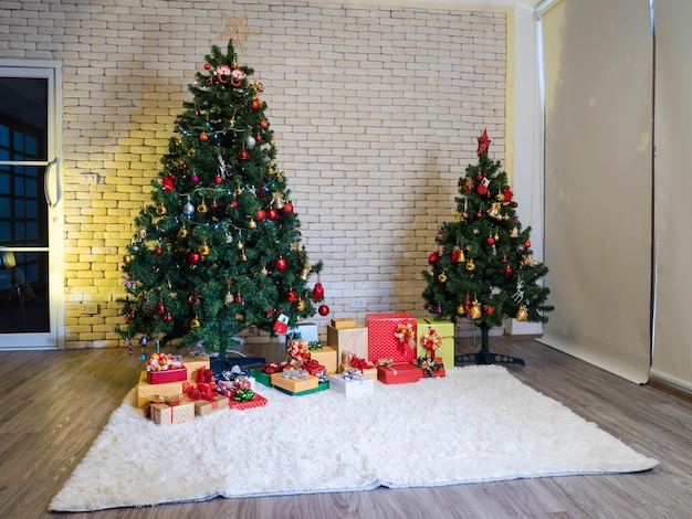 Decorated Christmas pine tree and many gifts on fur carpet in living room. celebrate on Christmas holidays and New year.