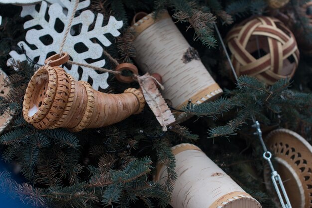 decorated Christmas tree Christmas toys made of birch bark light garlands for Christmas tree