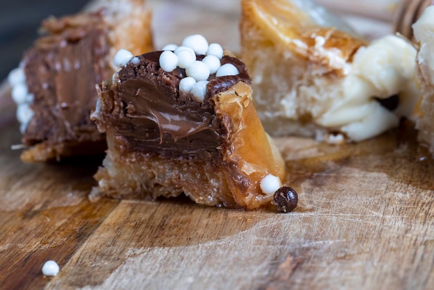 Decorated dessert of sweet puff pastry with chocolate filling and natural honey