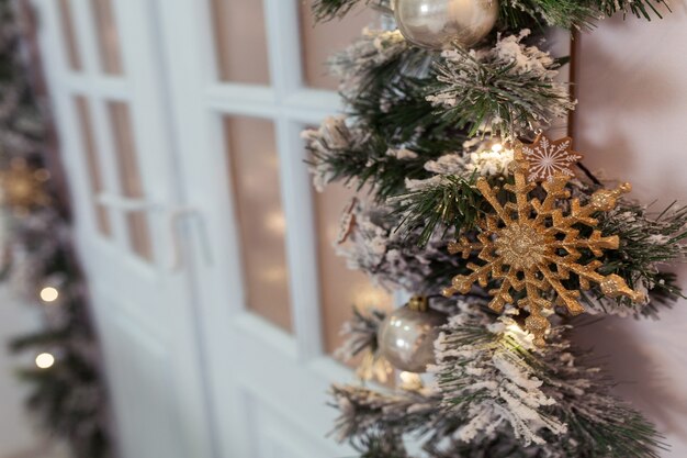 Decorated New Year room with beautiful fir tree and Christmas wreath