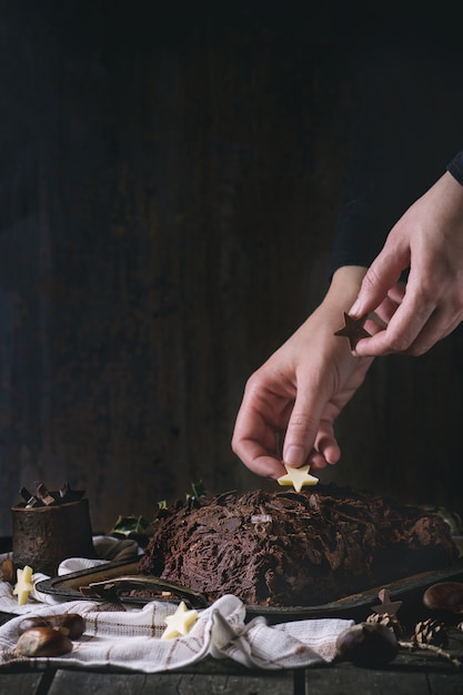 Photo decorating of christmas chocolate yule log