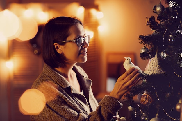 Decorating Christmas tree for holiday