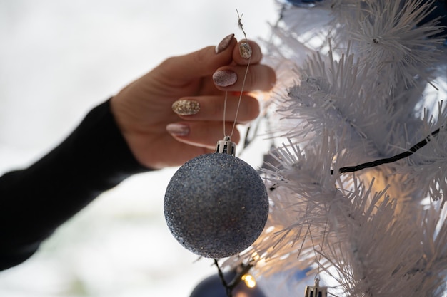 Decorating white christmas tree