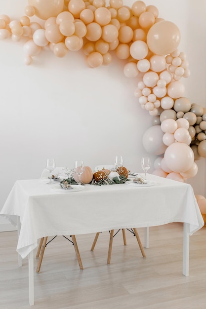 Decoration in boho style Pumpkins on the table with eucalyptus and gypsophila Stylish table decora