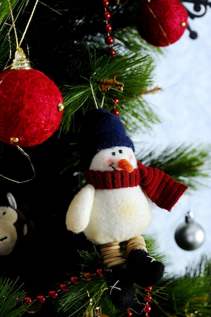 Decoration toy snowman on the Christmas tree A warm atmosphere of holiday