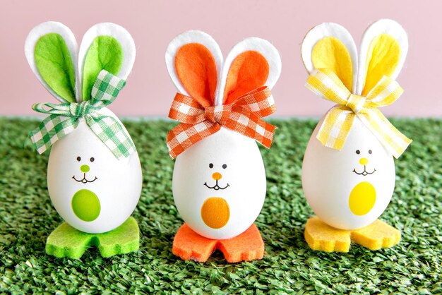 Decoration with easter eggs on grass background