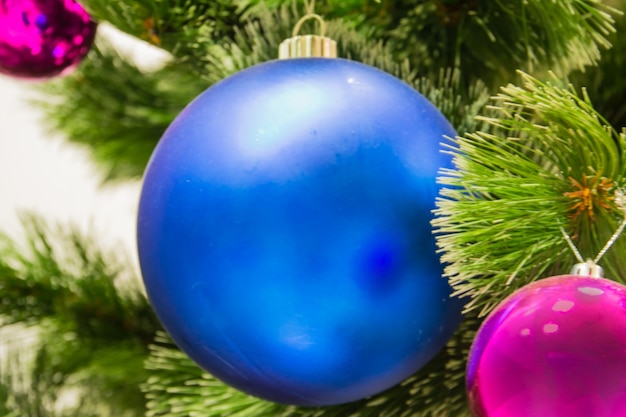 Decorations on Christmas tree. A large blue ball.