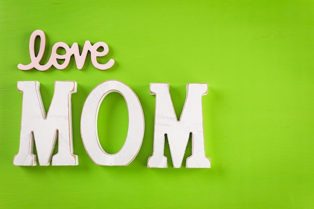 Decorations for Mother's Day on a  wood board.