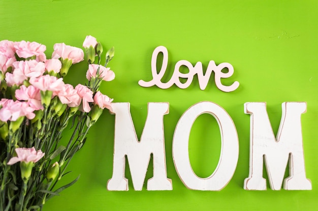 Decorations for Mother's Day on a  wood board.