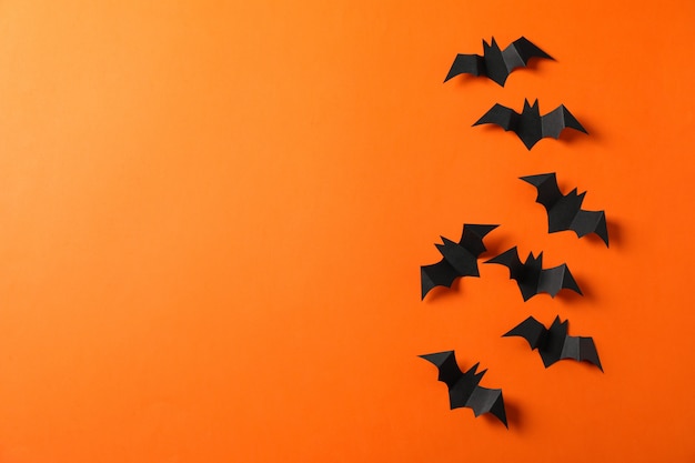 Decorative bats on orange table