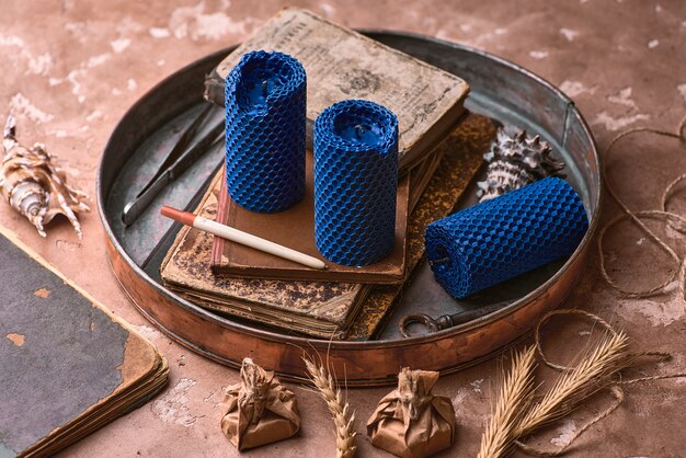 Decorative blue candles made of beeswax with a honey aroma for interior and tradition.