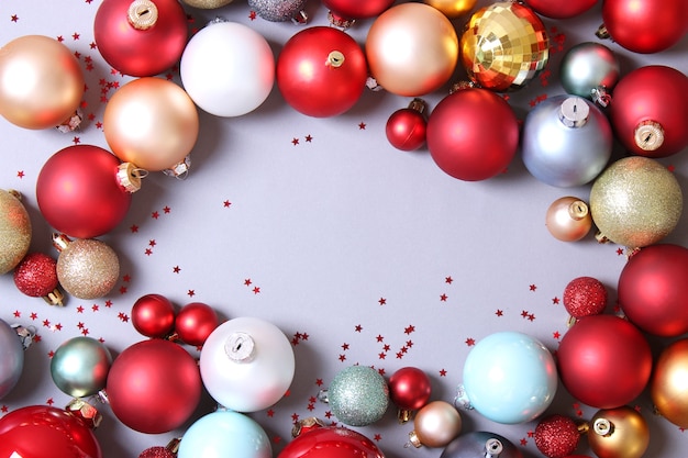 Decorative christmas balls on a colored background top view