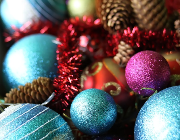 Decorative christmas balls and fir-tree cones close up.