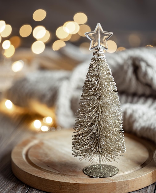 Decorative christmas tree on blurred background with bokeh