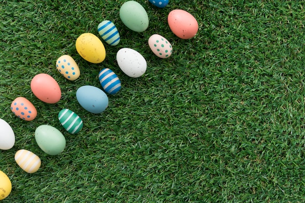 Decorative easter eggs on grass background