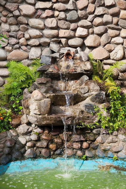 Decorative garden waterfall and pond made of stone