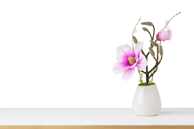 Decorative Pink Flower in vase on table isolated white background