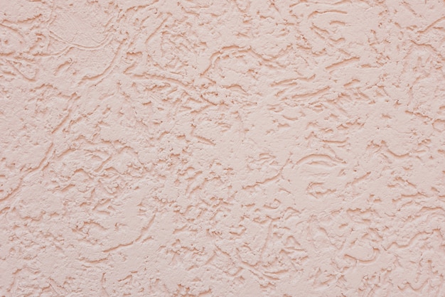 Decorative pink plaster textured background.