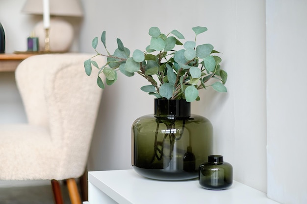 Decorative vase with artificial plants in the interior