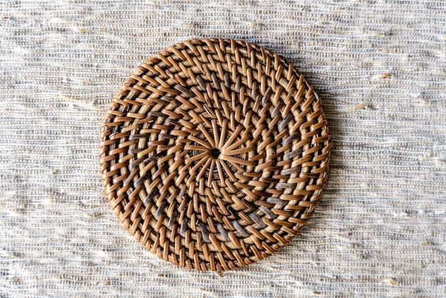 Decorative wicker stand on the table closeup top view