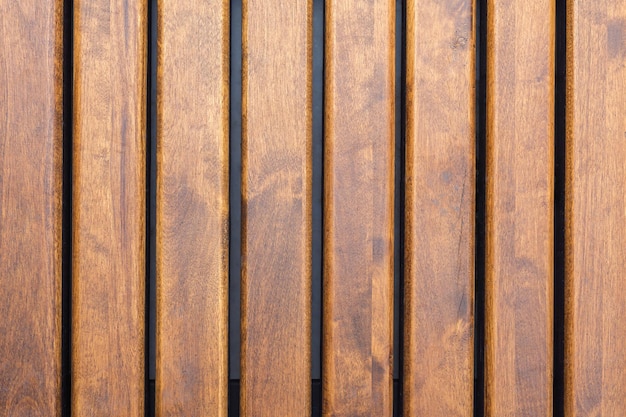 Decorative wooden picket fence close-up. Wood pattern and texture