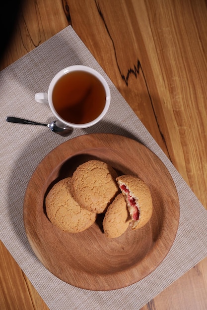 a decorative wooden plate is very beautiful for vegetables and cookies sweets and desserts