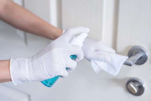 Deep cleaning for Covid-19 disease prevention. alcohol,disinfectant spray on Wipes of banister in home for safety,infection of Covid-19 virus,contamination,germs,bacteria for good hygiene.