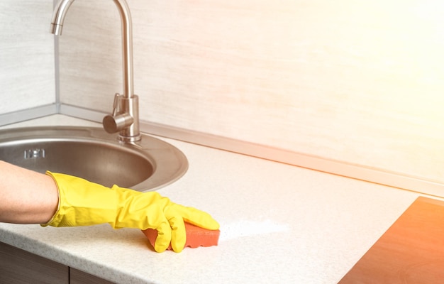 Deep Cleaning service woman gloves hands cleaning kitchen table Surface sanitizing Home cleaning and disinfecting wearing nitrile gloves