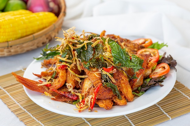 Deep fried fish with Thai herbs salad