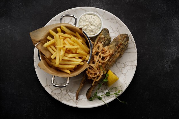 Deep Fried goby fish with fried potatoes