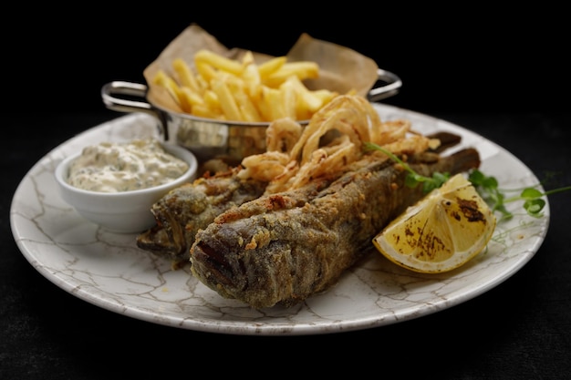 Deep Fried goby fish with fried potatoes