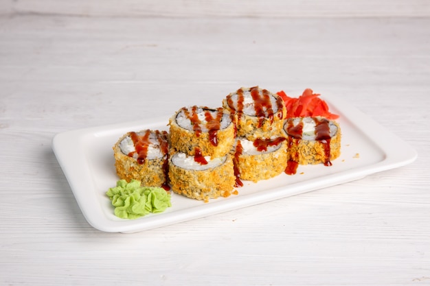 Deep-fried Japanese roll with tiriaki sauce. Traditional Japanese cuisine, menu