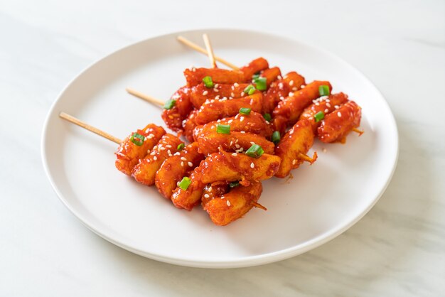 deep fried Korean rice cake (Tteokbokki) skewered with spicy sauce - Korean food style