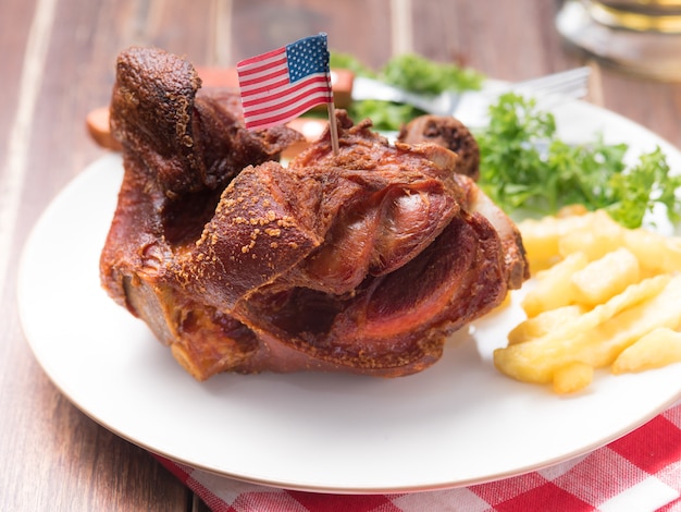 Deep Fried Pork Knuckle serve with French fried potatoes