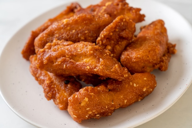 deep fried sliced potatoes stick with sesame. Thai food style