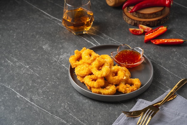 Deep fried squid rings breaded with thai sauce.