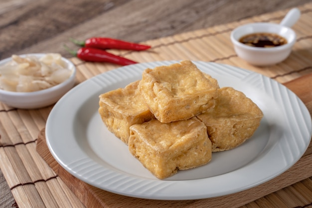 Deep fried stinky tofu, fermented bean curd with pickled cabbage vegetable, famous and delicious street food in Taiwan.