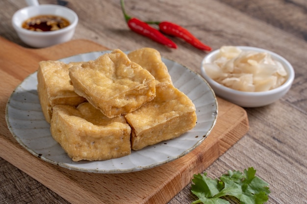 Deep fried stinky tofu, fermented bean curd with pickled cabbage vegetable, famous and delicious street food in Taiwan.